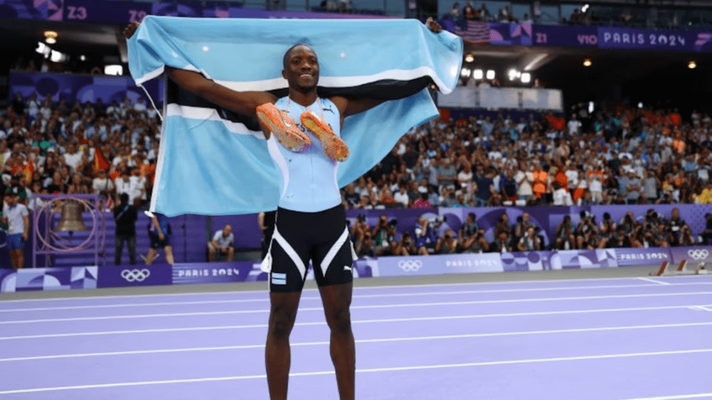 Botswana's president announced a public holiday on Friday to celebrate Letsile Tebogo’s historic victory in the 200-meter sprint, where he won the country's first Olympic gold medal at the Paris Games on Thursday. Tebogo's remarkable performance saw him surpass American sprinters Kenny Bednarek and Noah Lyles, making him the first African to claim the 200-meter title and the fifth-fastest man in history for this distance. The 21-year-old athlete honored his late mother, who passed away in May, by wearing spikes inscribed with her date of birth, symbolizing that she was with him in spirit during the race. In a statement shared on X, President Mokgweetsi Masisi expressed his pride, stating, "His Excellency President Masisi wishes to extend his heartfelt congratulations to Letsile and offers his gratitude to his late mother." Masisi emphasized that Tebogo's achievement deserved a nationwide celebration, noting it should be recognized in a unique, fitting, and responsible manner that would be remembered in Botswana's history. The president shared his personal excitement, revealing that he had lost his voice from cheering enthusiastically as he watched Tebogo clinch victory with an impressive time of 19.46 seconds. Botswana's president announced a public holiday on Friday to celebrate Letsile Tebogo’s historic victory in the 200-meter sprint, where he won the country's first Olympic gold medal at the Paris Games on Thursday. Tebogo's remarkable performance saw him surpass American sprinters Kenny Bednarek and Noah Lyles, making him the first African to claim the 200-meter title and the fifth-fastest man in history for this distance. The 21-year-old athlete honored his late mother, who passed away in May, by wearing spikes inscribed with her date of birth, symbolizing that she was with him in spirit during the race. In a statement shared on X, President Mokgweetsi Masisi expressed his pride, stating, "His Excellency President Masisi wishes to extend his heartfelt congratulations to Letsile and offers his gratitude to his late mother." Masisi emphasized that Tebogo's achievement deserved a nationwide celebration, noting it should be recognized in a unique, fitting, and responsible manner that would be remembered in Botswana's history. The president shared his personal excitement, revealing that he had lost his voice from cheering enthusiastically as he watched Tebogo clinch victory with an impressive time of 19.46 seconds. Botswana declares half-day holiday to mark first Olympic gold